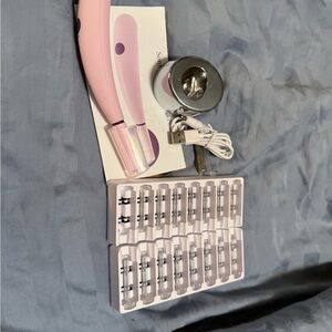 Sleek Pink Charging Device with Accessories